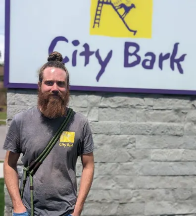 Hunter Cain standing outside in front of City Bark sign